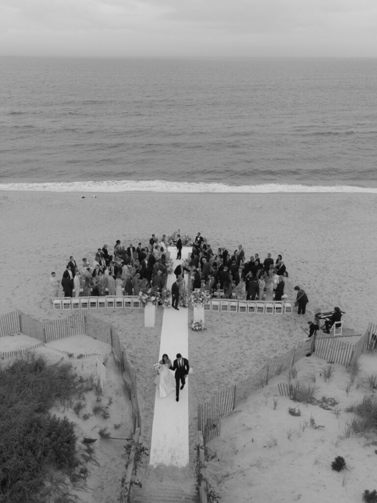 Aerial view of a wedding on the sand at Bridgehampton Tennis & Surf Club, Long Island, NY.
