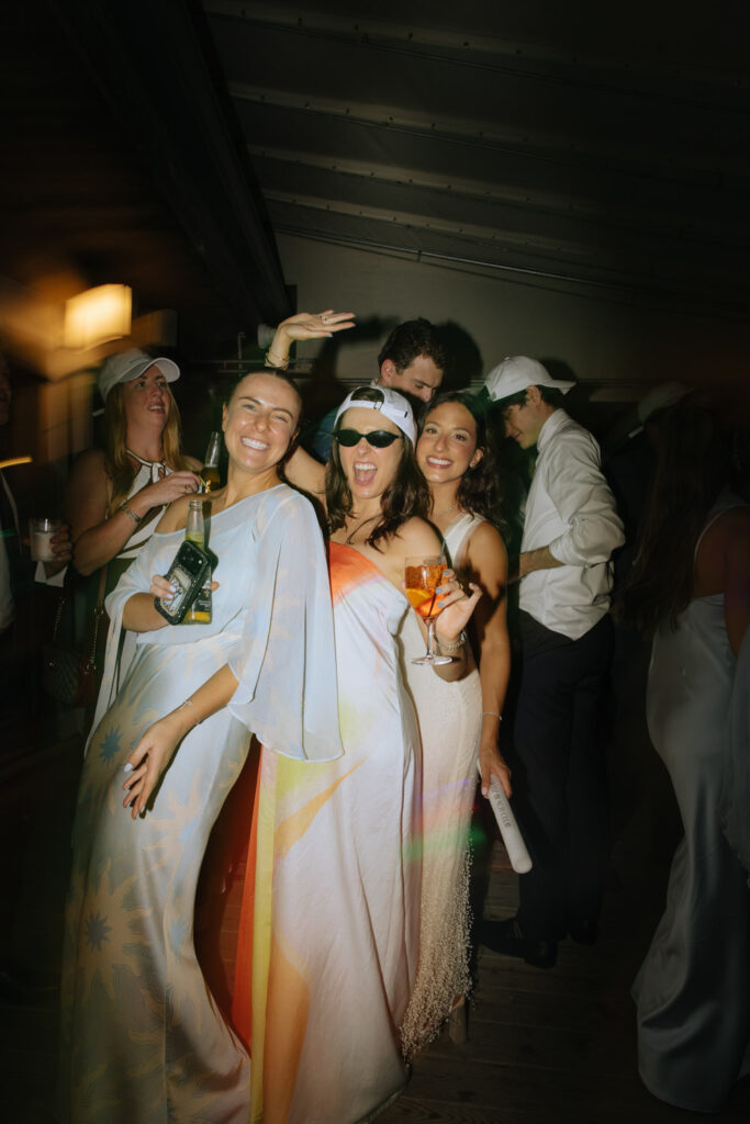 Wedding guests dancing and celebrating at the Bridgehampton Tennis & Surf Club reception