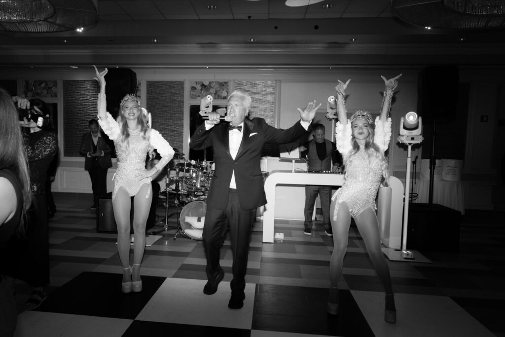 A live singer and two dancers performing at a Russo's on the Bay wedding in Queens, New York.