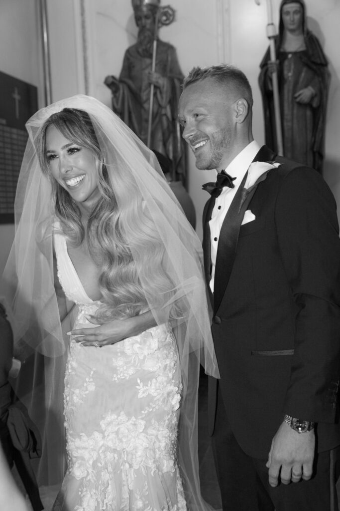 The bride and groom smiling at their wedding ceremony at Russo's on the Bay, Queens.