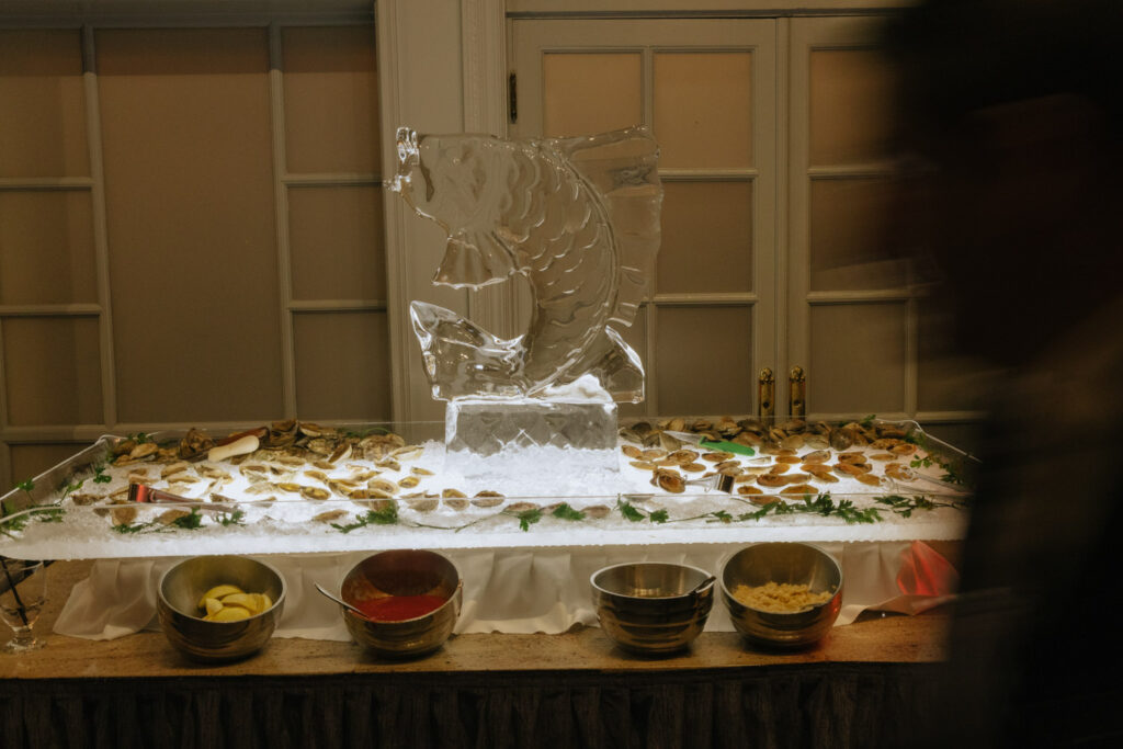 An ice sculpture of a fish on a seafood buffet at a wedding at Russos on the Bay.