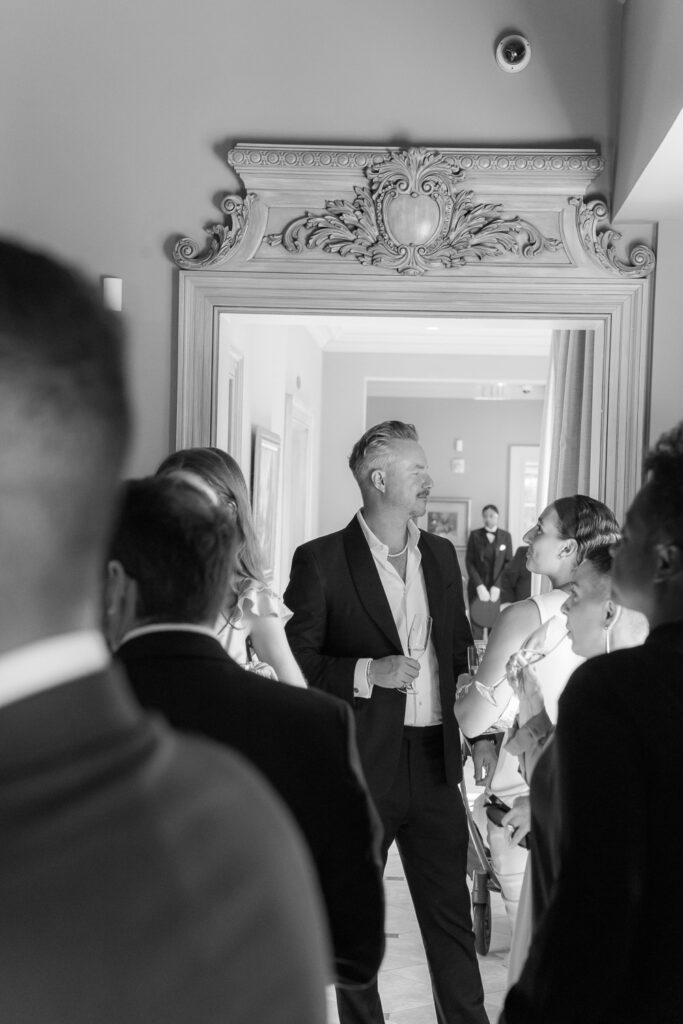 Wedding guests mingling during the cocktail hour at Park Chateau Estate & Gardens in East Brunswick, New Jersey.