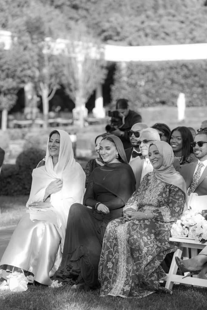Guests watch the outdoor ceremony at Menah and Ashraf's Palestinian-Egyptian Muslim wedding in New Brunswick.