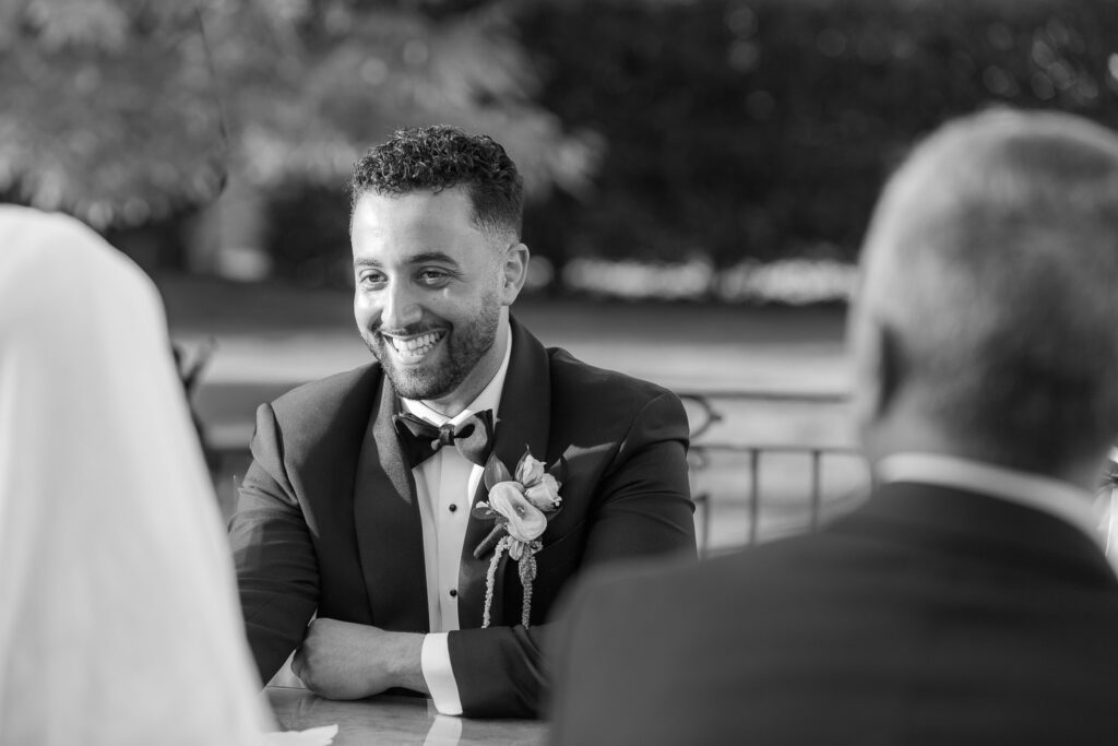 Groom Menah smiles during his Palestinian-Egyptian Muslim wedding at Park Château Estate & Gardens.