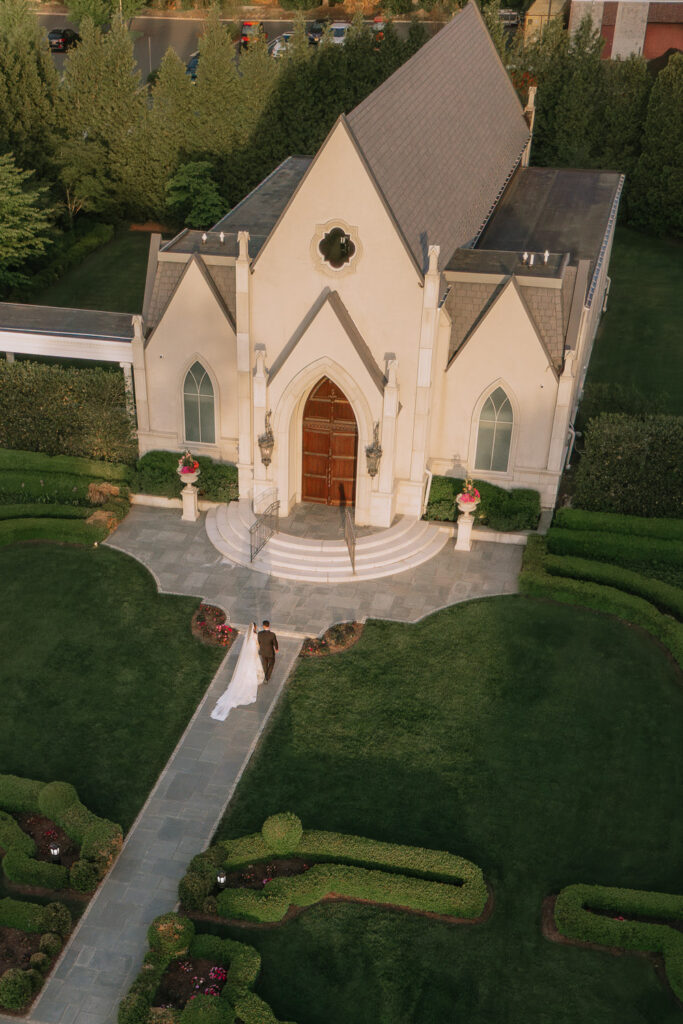 Aerial view of a bride and groom walking towards the Park Chateau in New Brunswick, New Jersey.