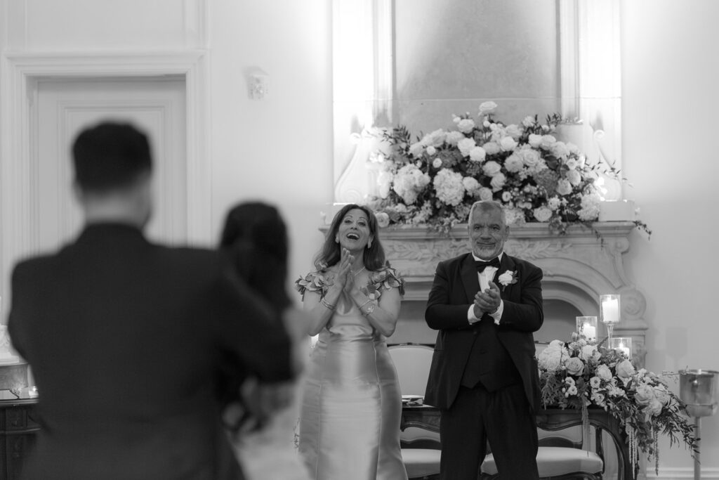 Wedding guests applaud during Menah and Ashraf's Palestinian-Egyptian Muslim wedding at Park Château Estate & Gardens.