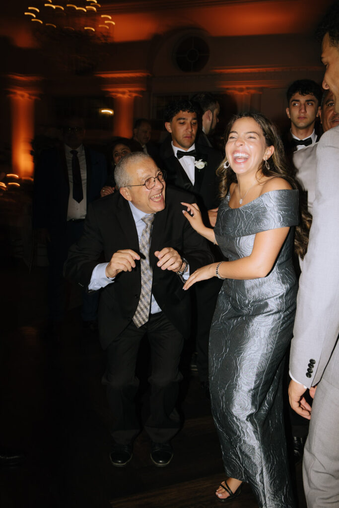 People dancing on a reception dance floor during a Palestinian-Egyptian Muslim wedding at Park Château.