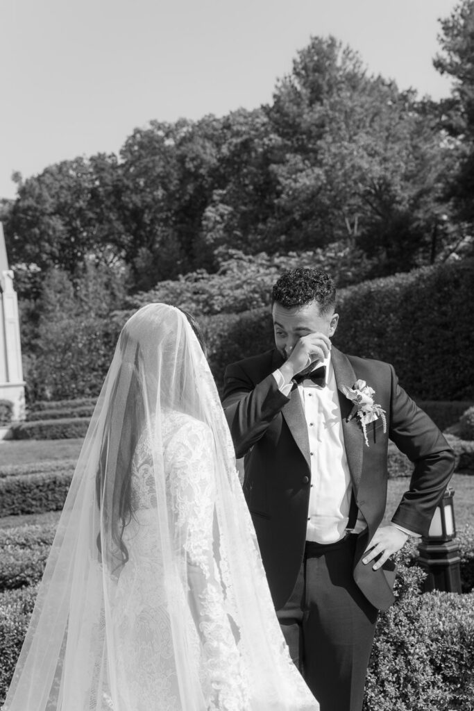 Groom wiping his eye during a Muslim wedding first look at Park Chateau Estate & Gardens, NJ.