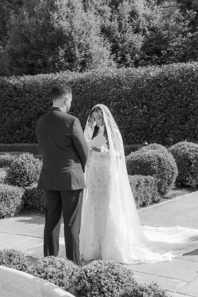 A groom stands with his bride wiping away a tear during their Palestinian-Egyptian Muslim wedding ceremony at Park Chateau.